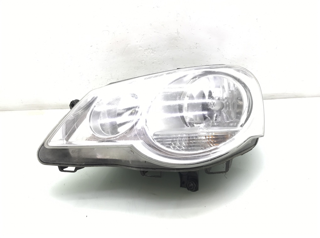 Фара левая для Volkswagen Polo, 2006 г. 1.2 i бензин б/у