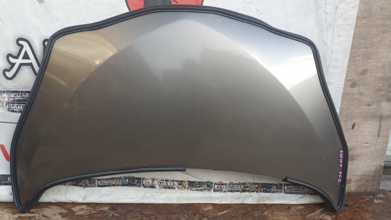 Капот TOYOTA RACTIS SCP100 2SZFE 2006 (б/у)