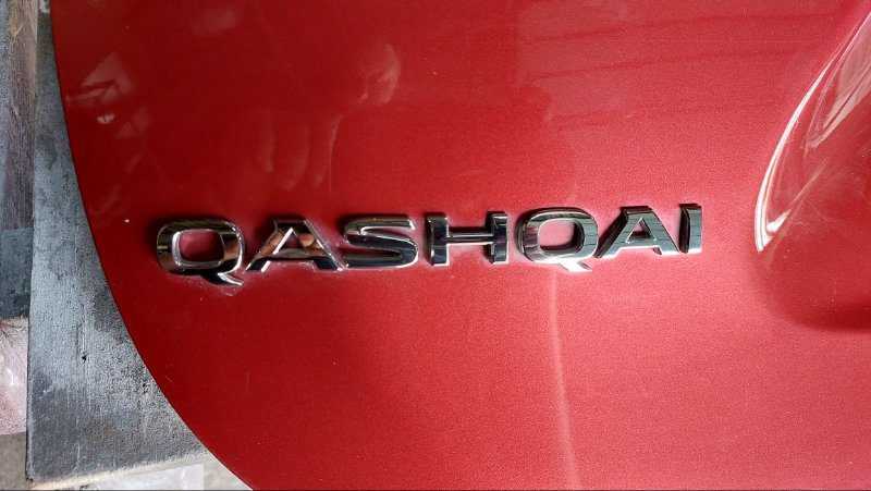Эмблема Nissan Qashqai J11E H5FT задняя