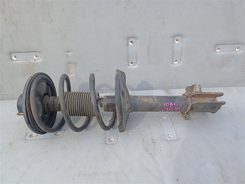 Стойка Mitsubishi Pajero Io H76W 4G93T передняя левая (б/у)
