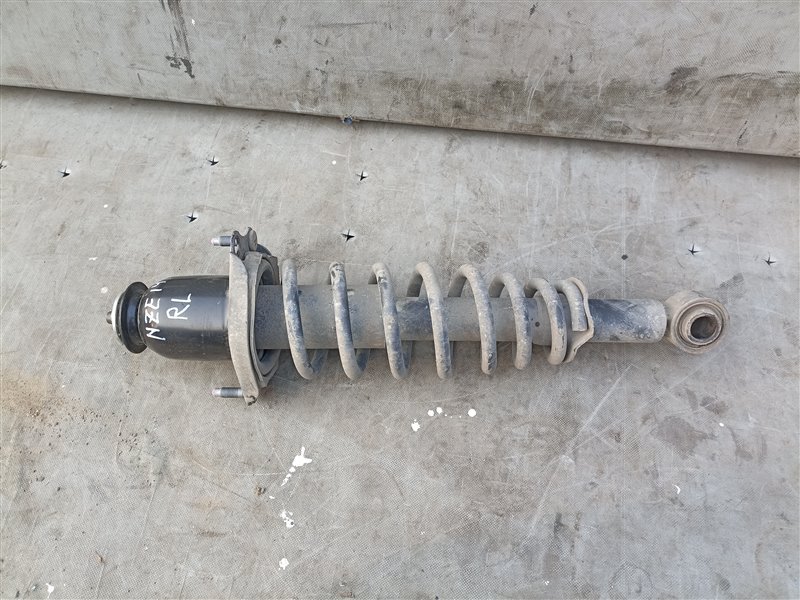 Стойка TOYOTA COROLLA FIELDER NZE141 1NZ-FE задняя левая (б/у)