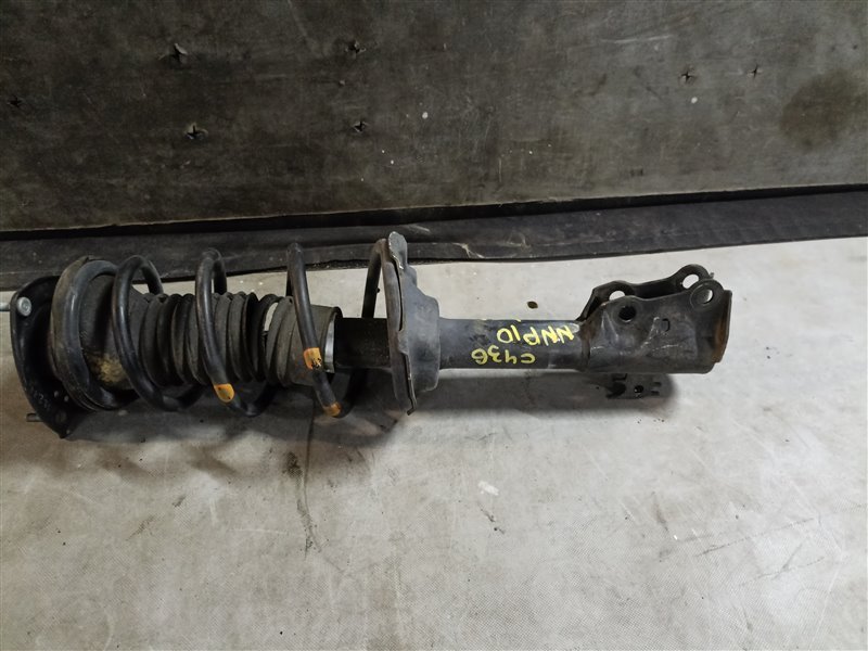 Стойка TOYOTA PORTE NNP10 2NZ-FE передняя левая (б/у)