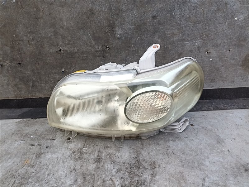 Фара TOYOTA PORTE NNP10 левая (б/у)