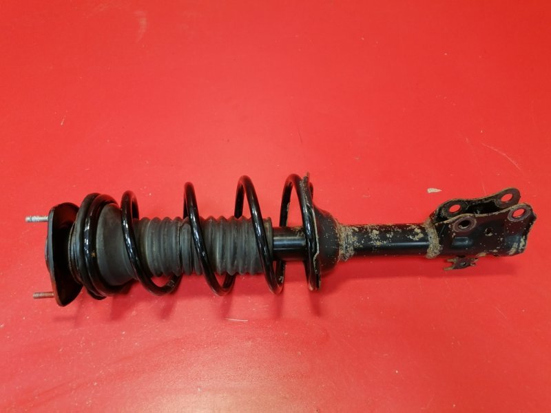 Стойка подвески Toyota Funcargo NCP21 1NZ-FE 2002 передняя левая (б/у)
