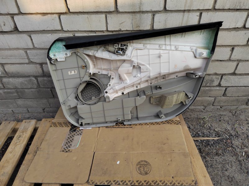 Обшивка двери передняя левая Primera 2004 WTP12