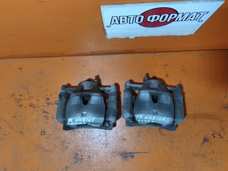 Суппорт TOYOTA corolla axio NKE165 1NZ-FXE 2013 передний (б/у)