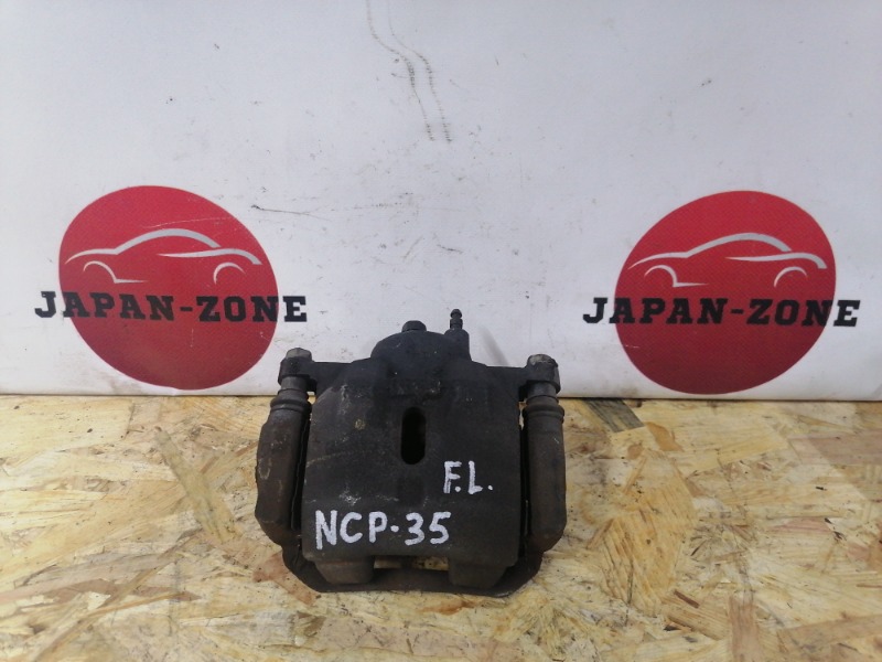 Суппорт Toyota Bb NCP35 1NZ-FE 2000 передний левый (б/у)