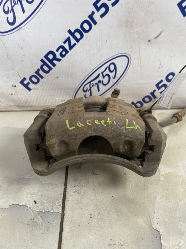 Запчасть суппорт передний левый Chevrolet Lacetti 2004-2013 J200 Б/У Суппорт передний левый Chevrolet Lacetti 2004-2013 J200 Б/У