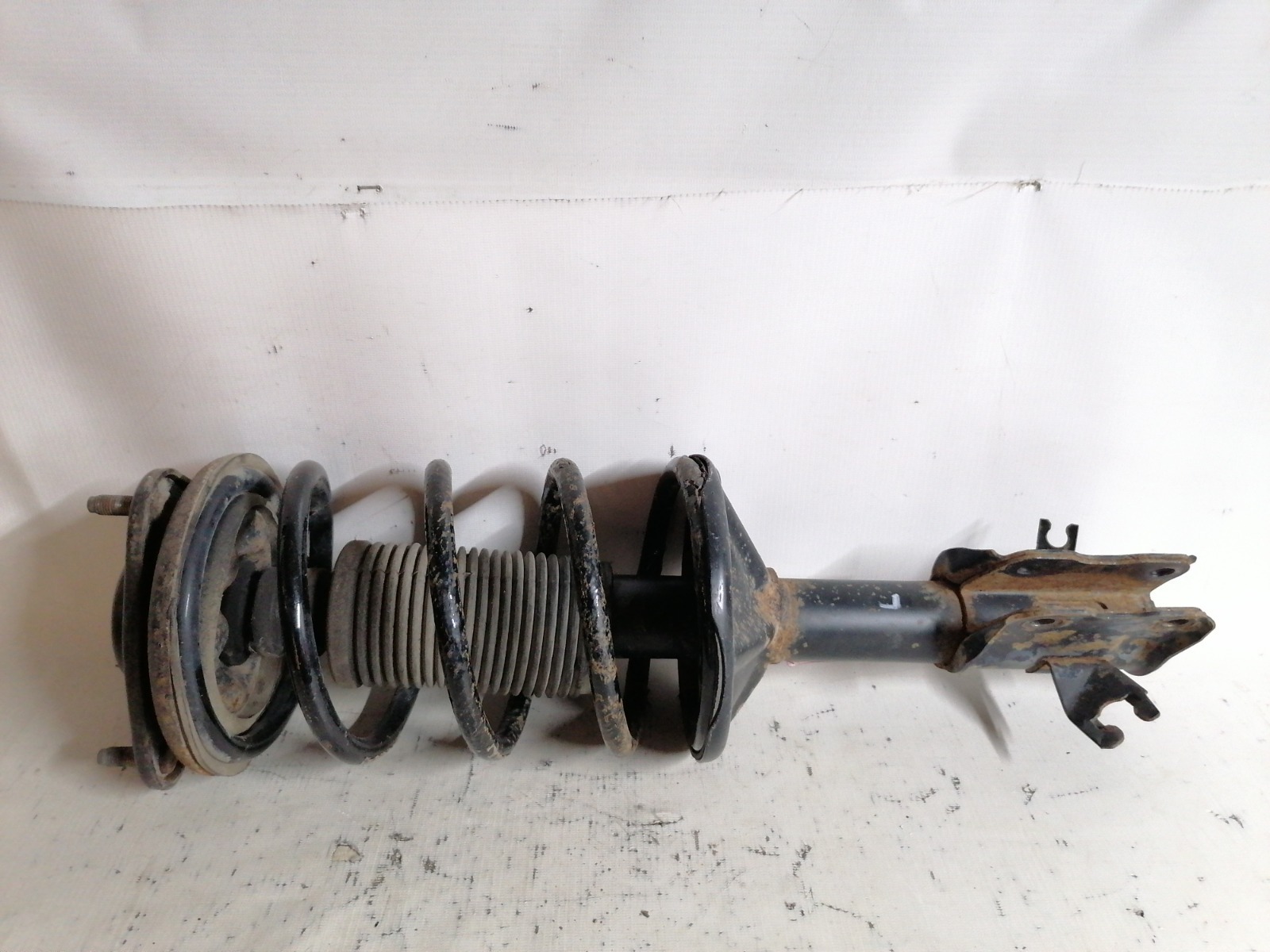 Амортизатор Mitsubishi Lancer CM2A 4G15 1999 передний левый (б/у)