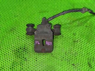 Суппорт тормозной передний левый Nissan March 2000