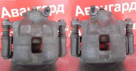 Запчасть суппорт тормозной передний Nissan Cefiro 1990