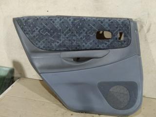 Обшивка двери задней левой (дверная карта) Mazda 323 2000 Б/У Обшивка двери задней левой (дверная карта) Mazda 323 2000
