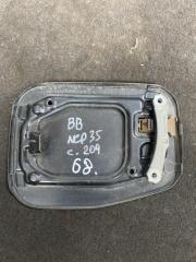 Фото запчасти лючок бензобака TOYOTA BB контрактная запчасть Запчасть лючок бензобака TOYOTA BB