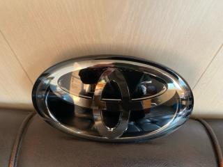 Эмблема TOYOTA LAND CRUISER PRADO TRJ150 2TR 90975-02159 3 ракурс Эмблема TOYOTA LAND CRUISER PRADO TRJ150 2TR 90975-02159 3 ракурс
