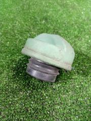 Фото запчасти крышка топливного бака Mitsubishi Carisma контрактная запчасть Запчасть крышка топливного бака Mitsubishi Carisma