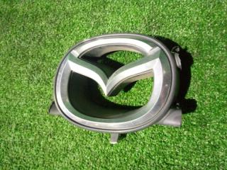 Эмблема Mazda Demio 2000