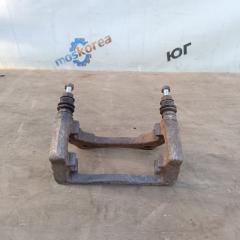 Фото запчасти скоба суппорта передняя Lada Largus Б/У запчасть Запчасть скоба суппорта передняя Lada Largus