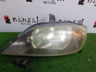 Фара галогеновая левая Mazda Demio 2002