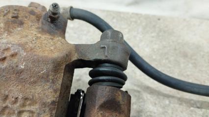 Суппорт тормозной передний левый MITSUBISHI Mirage CK5A 4G93