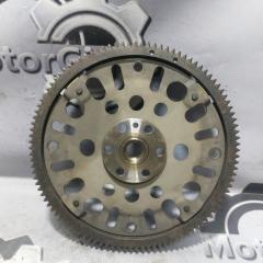 Фото запчасти маховик Nissan March 2006 контрактная запчасть Запчасть маховик Nissan March 2006