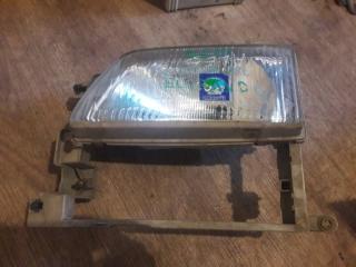 Фара левая Nissan Elgrand 1997