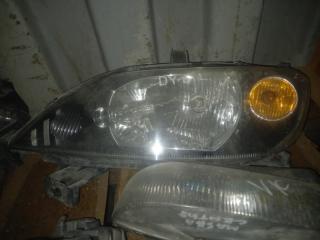 Фара Mazda Demio 2003