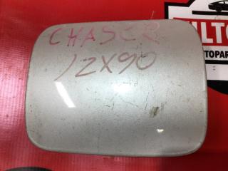 Фото запчасти лючок бензобака TOYOTA CHASER контрактная запчасть Запчасть лючок бензобака TOYOTA CHASER