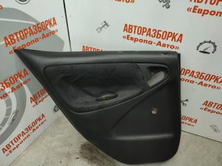 Запчасть обшивка двери задняя левая Toyota Yaris 2005
