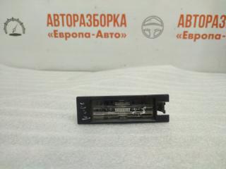 Фото запчасти фонарь подсветки номера Opel Corsa D 2007 Б/У запчасть Запчасть фонарь подсветки номера Opel Corsa D 2007