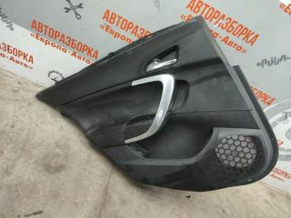 Фото запчасти обшивка двери задняя левая Opel Insignia 2011 Б/У запчасть Запчасть обшивка двери задняя левая Opel Insignia 2011