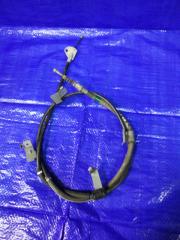 Запчасть трос стояночного тормоза левый Toyota Prius