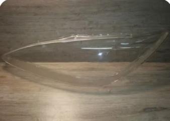 Запчасть стекло фары левое Toyota Camry 2004-2006 рест.