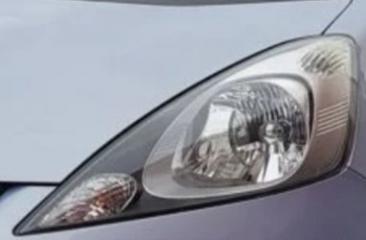 Запчасть стекло фары левое Honda Fit 2008-2010 дорест.