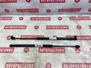 Запчасть амортизатор двери багажника задний левый MAZDA DEMIO