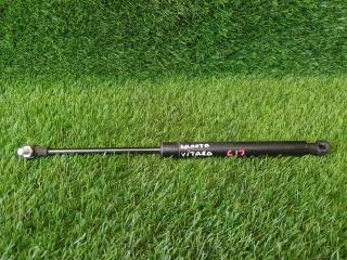 Фото запчасти амортизатор капота Suzuki Vitara 2018 Б/У запчасть Запчасть амортизатор капота Suzuki Vitara 2018