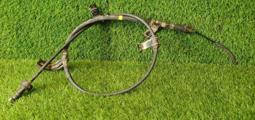 Фото запчасти трос ручного стояночного тормоза ручника Kia Rio 2 хетчбэк 2010 Б/У запчасть Запчасть трос ручного стояночного тормоза ручника Kia Rio 2 хетчбэк 2010