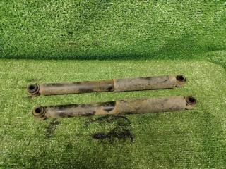 Фото запчасти амортизатор подвески задний Nissan NP300 2011 Б/У запчасть Запчасть амортизатор подвески задний Nissan NP300 2011