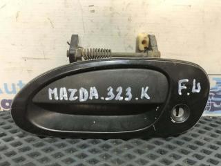 Фото запчасти ручка двери нaружная передняя левая Mazda 323C 1995 Б/У запчасть Запчасть ручка двери нaружная передняя левая Mazda 323C 1995