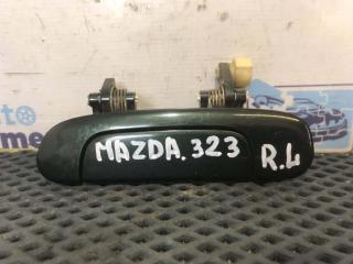 Фото запчасти ручка двери задняя левая Mazda 323 2003 Б/У запчасть Запчасть ручка двери задняя левая Mazda 323 2003