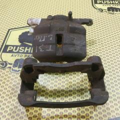 Суппорт передний левый Nissan Xtrail 2009