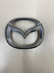 Фото запчасти эмблема на решетку радиатора Mazda BT-50 Б/У запчасть Запчасть эмблема на решетку радиатора Mazda BT-50