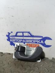 Запчасть ручка двери внутренняя левая Mitsubishi Lancer 2000