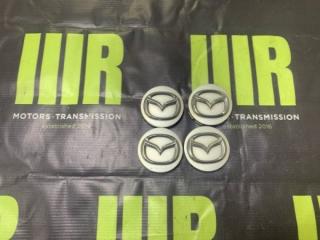 Фото запчасти центральная заглушка диска MAZDA контрактная запчасть Запчасть центральная заглушка диска MAZDA