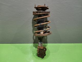 Стойка подвески передняя левая Kia Clarus 1999 Б/У Стойка подвески передняя левая Kia Clarus 1999