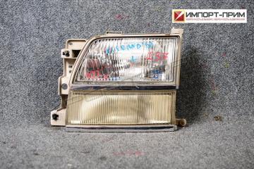 Фара передняя левая Nissan ELGRAND 1999