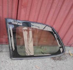 Стекло собачника левое Toyota Corolla Fielder