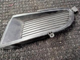 Заглушка бампера передняя левая Mitsubishi Lancer 2000-2007