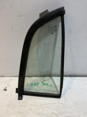 Запчасть стекло заднее левое Mitsubishi L200 2006-2014