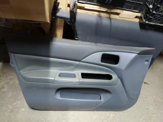 Обшивка двери передняя левая Mitsubishi Lancer Cedia 2000-2003