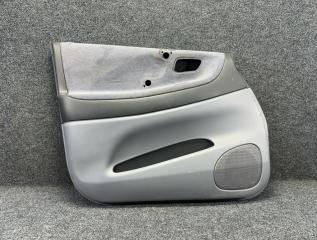 Обшивка дверей передняя левая Suzuki Aerio 2003